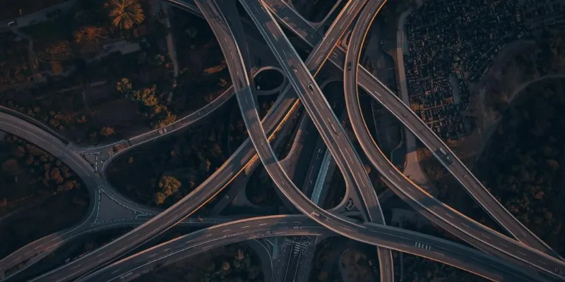 Aerial view of highway interchange at dusk — multiple customer acquisition channels converging